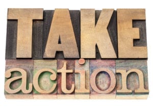 Improve Dental Front Office Efficiency When You Take Action. A wooden sign says "Take Action"