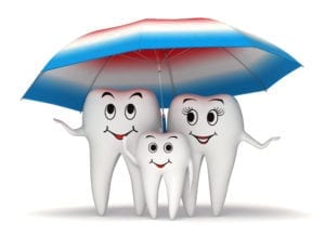 3 smling teeth under an umbrella. The teeth are even happier with dental block scheduling