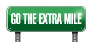 Go The Extra Mile Sign Represents All The Efforts Needed in Working Overdue Patient Accounts