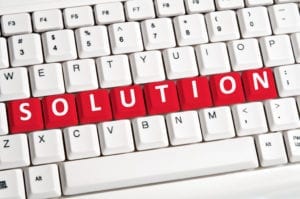 A computer keyboard spells out the word solution. A dental front office consultation could be the solution you need to solve a front office problem in your dental office.