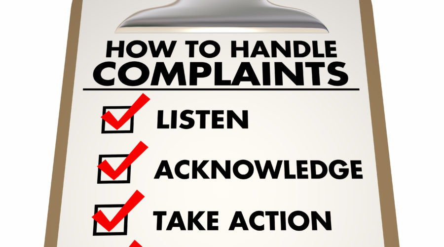 A clipboard with a check sheet shows "How To Handle Patient Complaints"