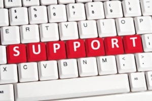 The words "support" are displayed on a keyboard. Monthly support is available for the dental front office team here.